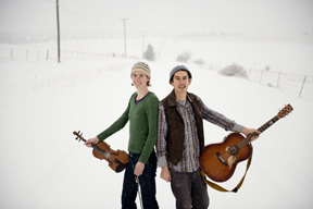 Organic farmers Johanna Davis and Adam Nordell spend their off season playing folk shows and contra dances across the country as the Sassafras Stomp. This winter the couple started their tour in late November and traveled across the country to Montana where Nordell grew up. The duo will play shows across the the state during the month of January. Here they are pictured on a snowy road in Missoula, Montana, January 4, 2015.